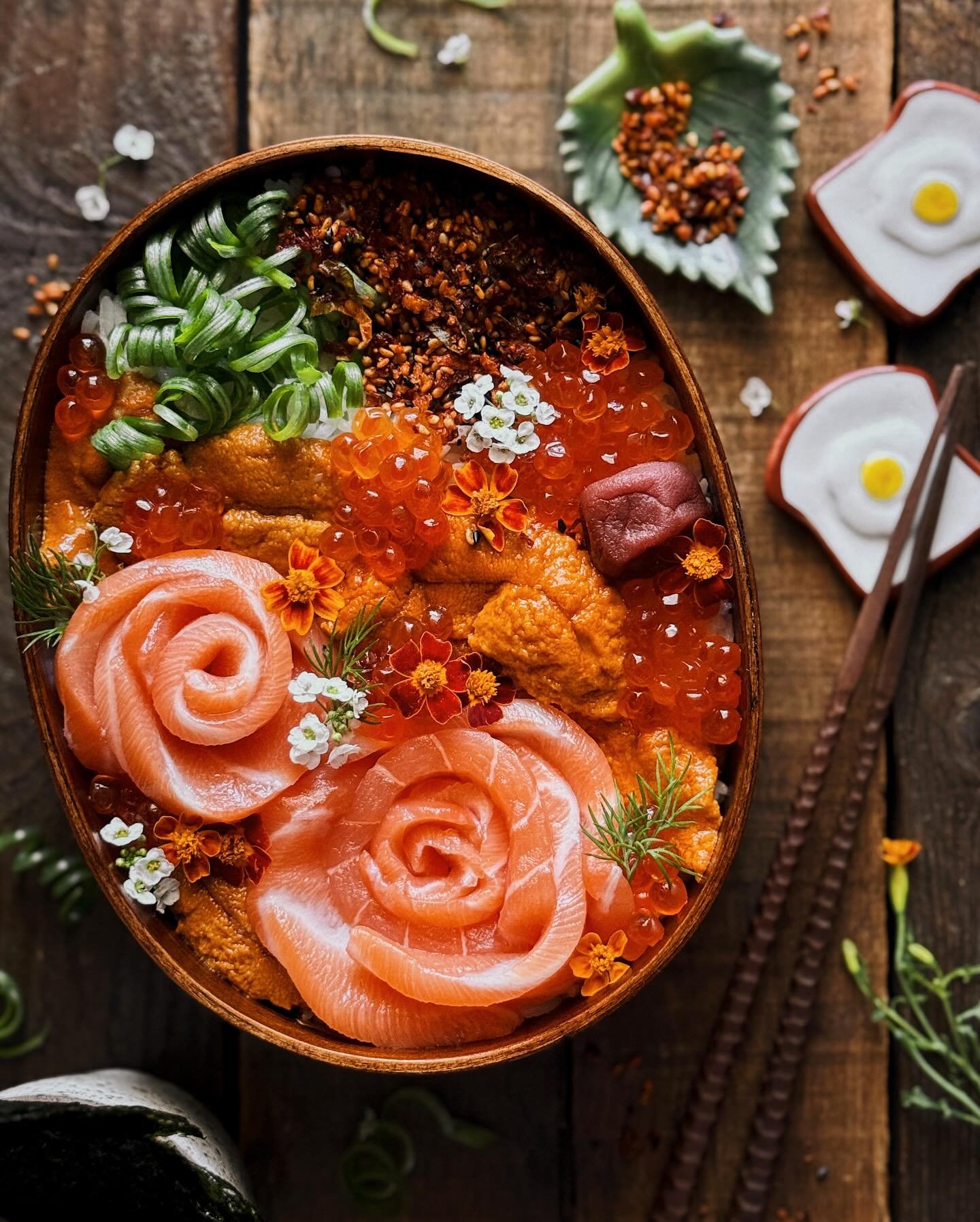 I&rsquo;m doing a giveaway with this post, so be sure to read to the end for details!⁣
⁣
First, the photo details: I made a donburi-style bento with a layer of rice on the bottom topped with salmon sashimi rosettes, uni, and salmon roe/ikura. Other a