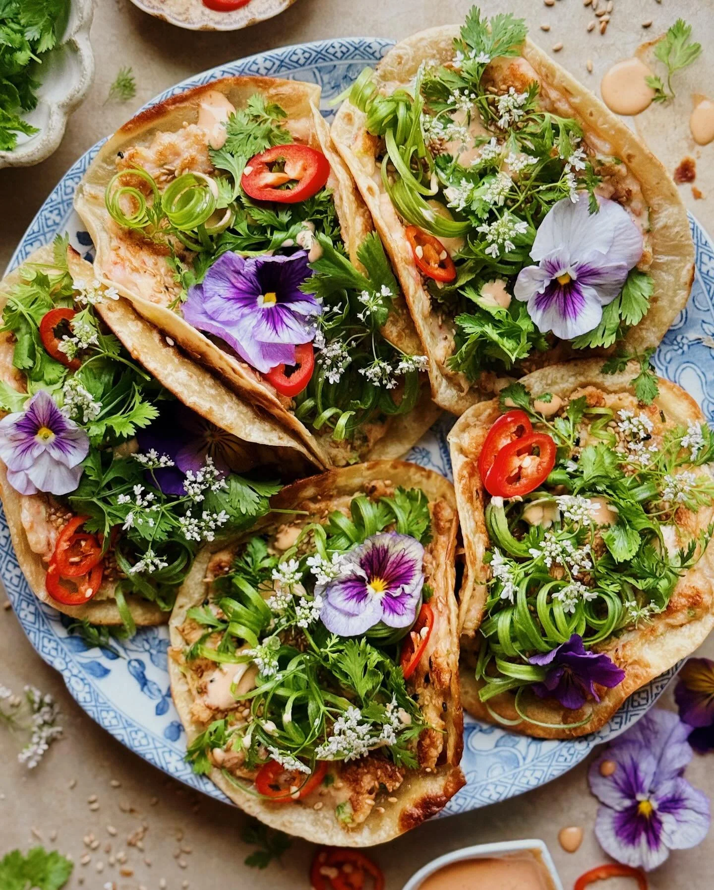 Shrimp toast smashed tacos.&thinsp;
&thinsp;
These have a bouncy, aromatic Chinese-style shrimp paste smeared onto delicate flour tortillas and then coated with a layer of sesame seeds. They are pan-fried until the sesame seeds get toasty and nutty a