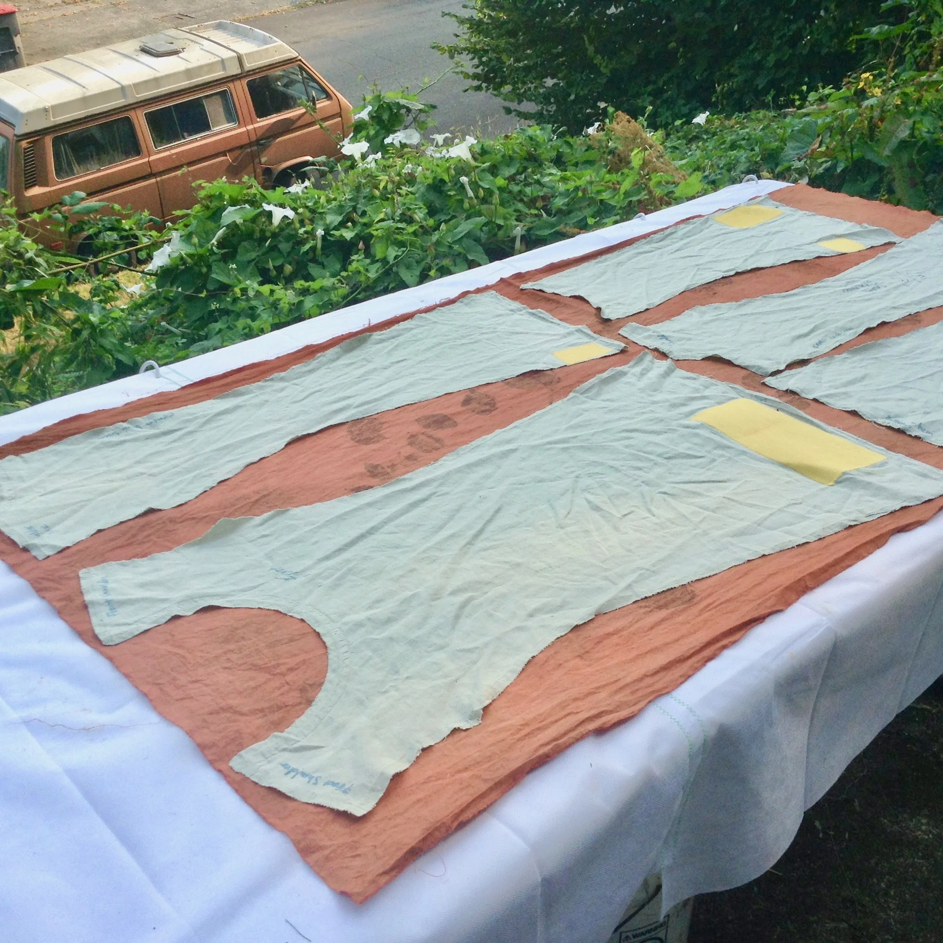 Laying out pattern pieces on madder dyed cotton to make a new dress – you need to cut away some unnecessary parts in order to create the form you want.