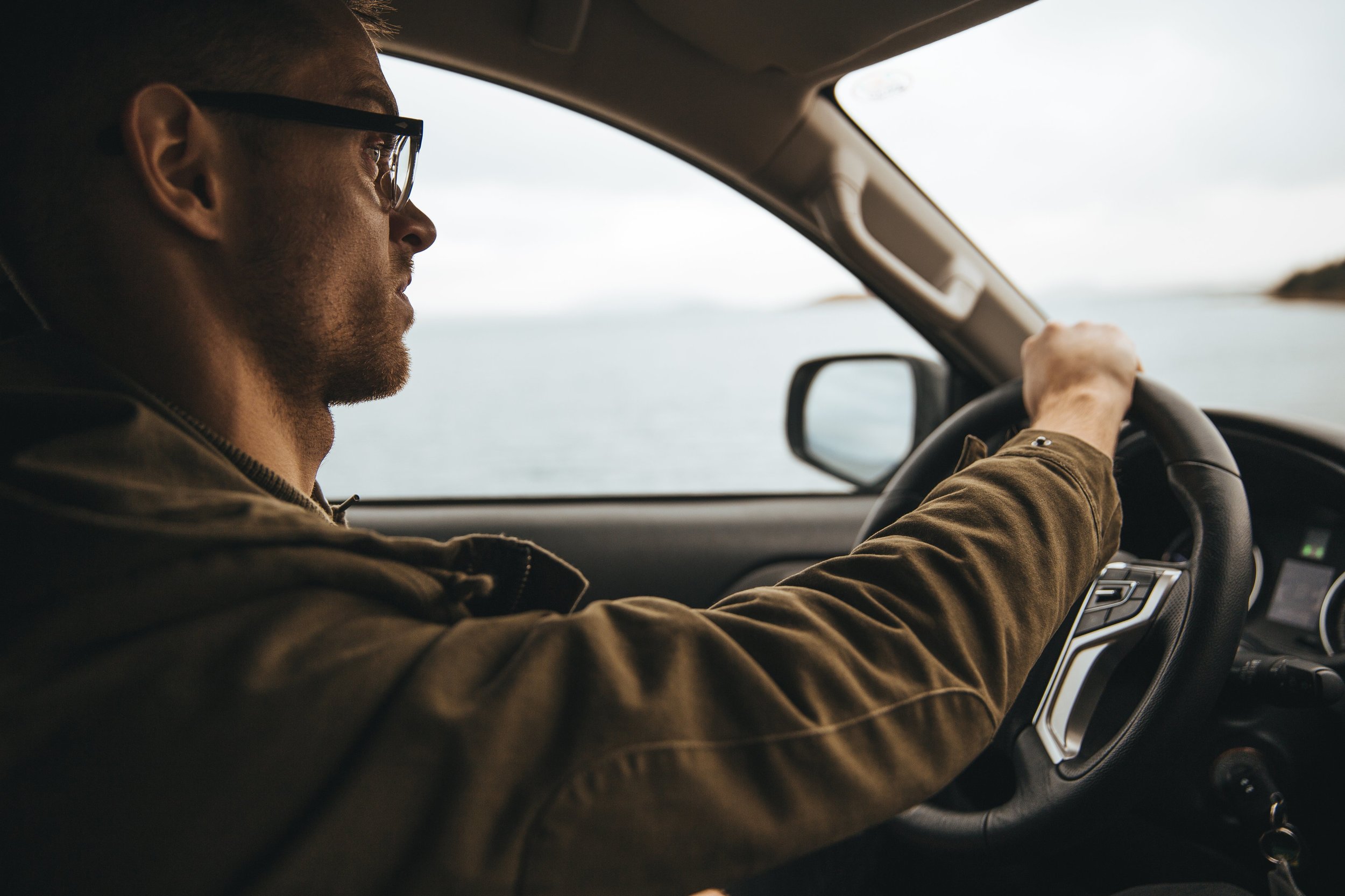 man-with-glasses-driving_4460x4460.jpg