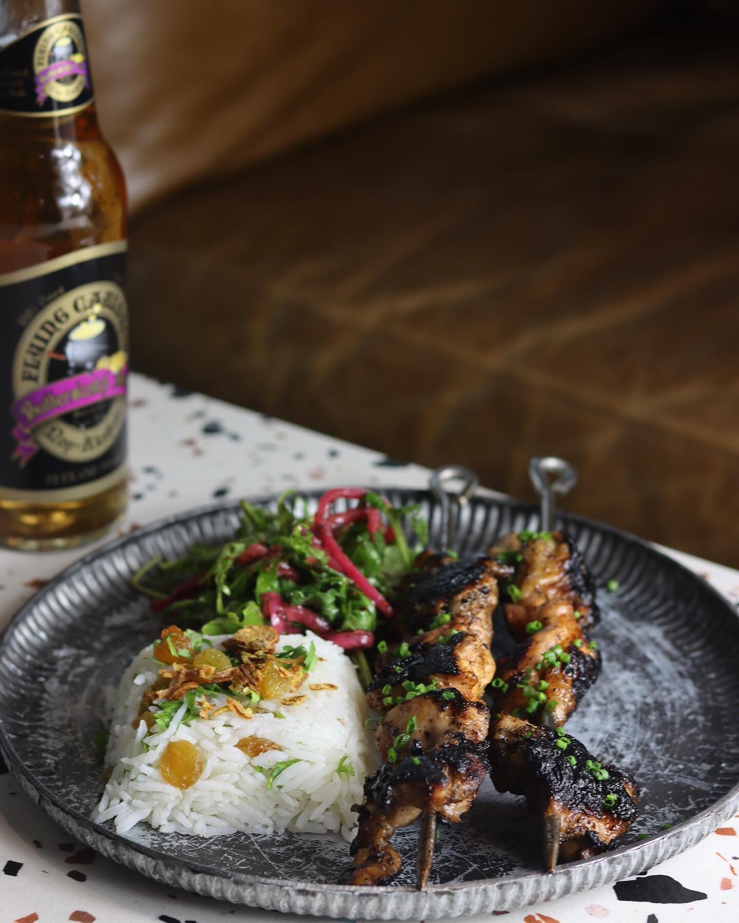 Grilled to perfection for that smokey, charred flavour, we rate this a 10/10. Barbecued chicken thigh skewers, native Australian saltbush, and pepper leaf. 

Available at Working Title Riverside, Dinnertime 6PM &mdash; 10PM.