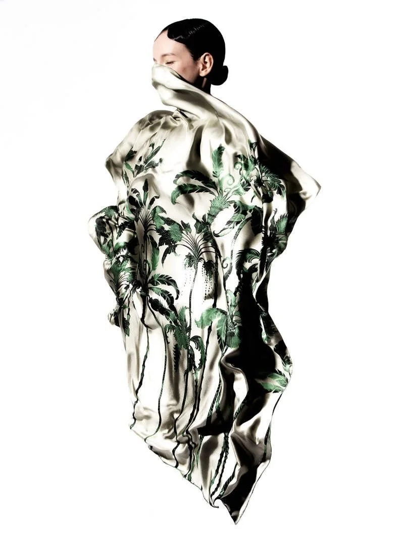 A grand carr&eacute; to create architecture for the silhouette.
Hand‑painted artwork, reflected in two colorways on both sides of the silk twill. 
Edges rolled by hand, as if the silk remembers the gesture.

#surrealism 
#multiwearable 
#silkcarr&eac