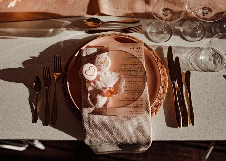 Hand painted wedding macarons on place setting