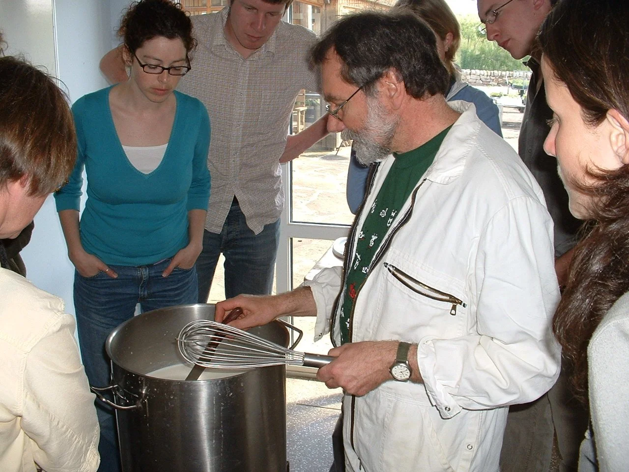 Hans teaching how to make cheese 1.jpg