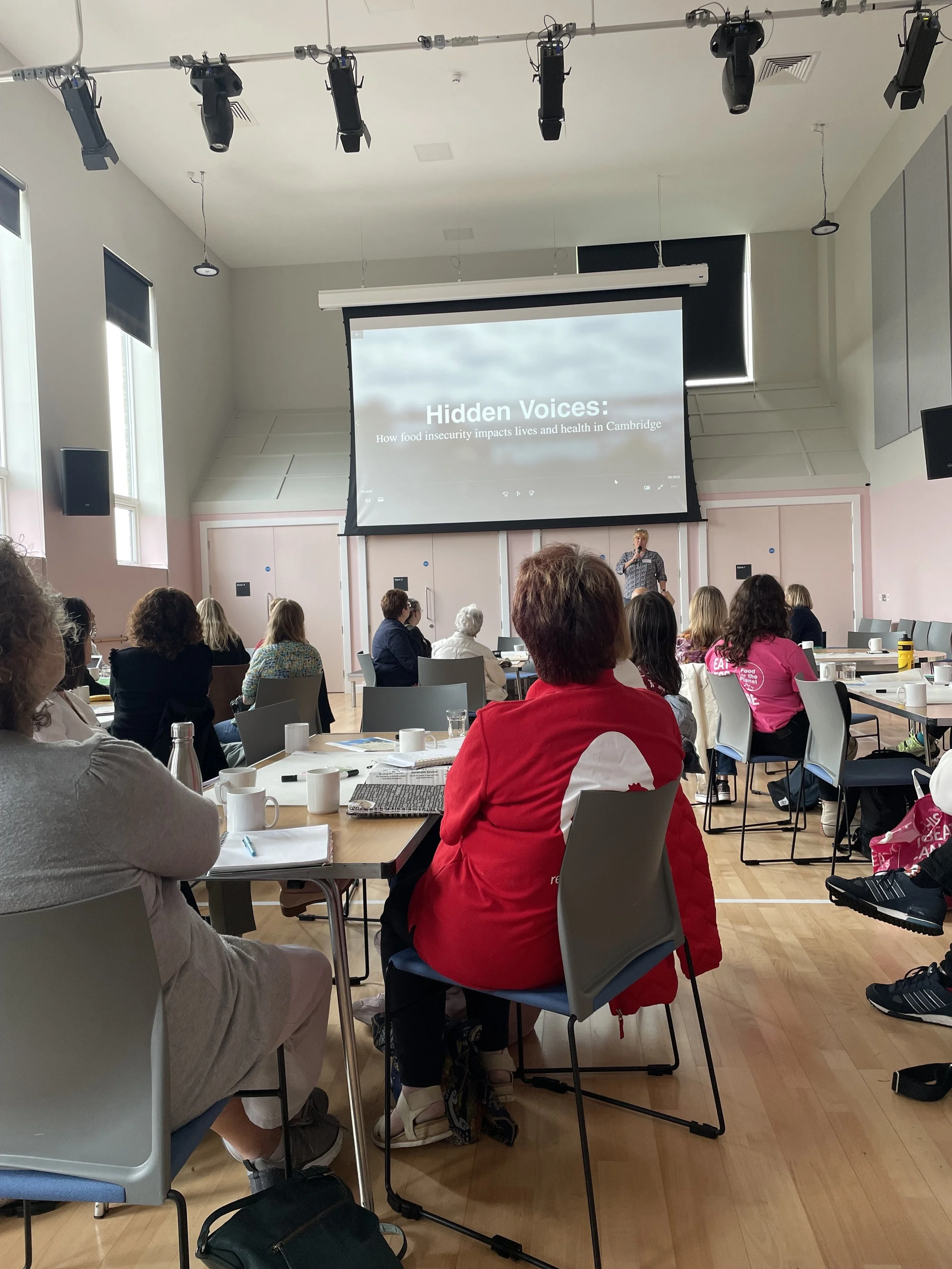 Attendees at the Cambridge Food Justice Conference 2023 watching Hidden Voices film