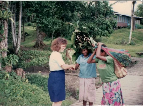 Jeanette meeting with some neighbors to purchase fresh produce from their gardens.
