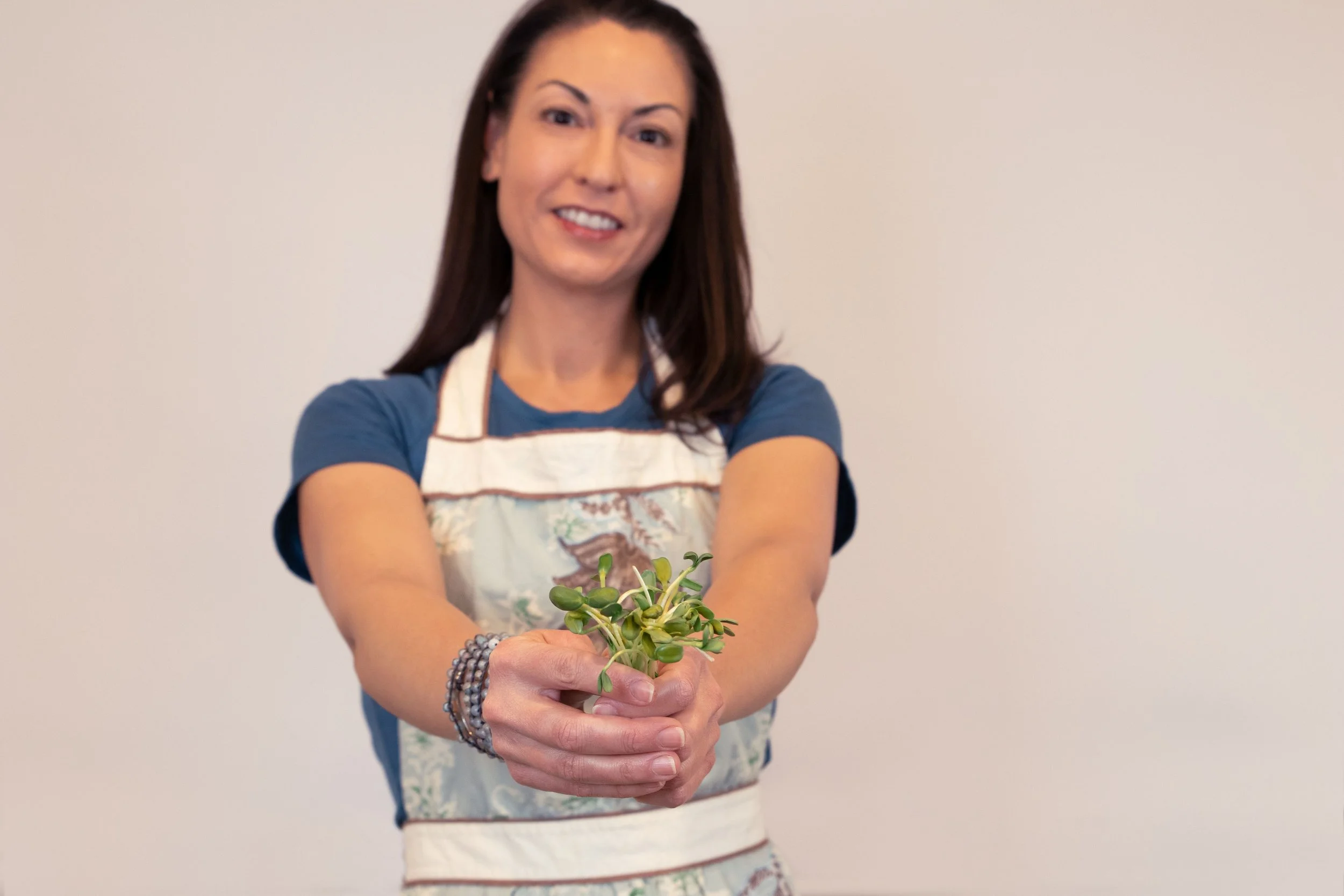 Trish with sunflower microgreens.jpeg