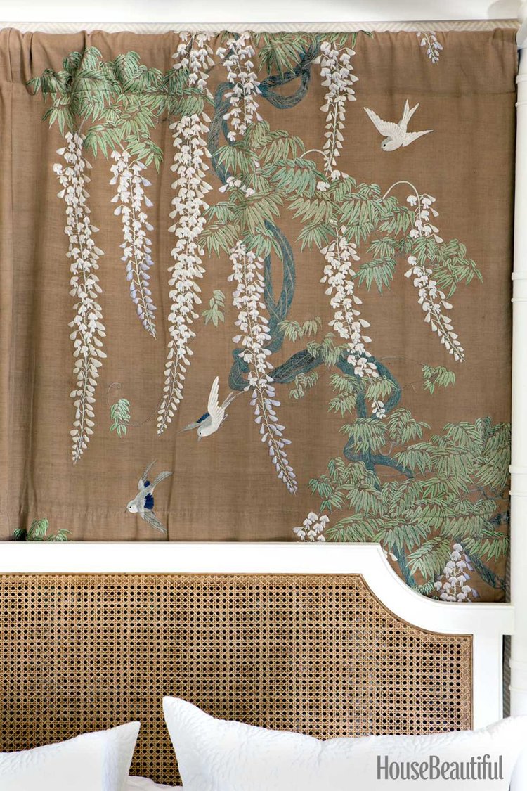 Master Bedroom   A 1920s Japanese hand-embroidered curtain panel from a Pasadena estate hangs behind the cane headboard on the four-poster in the master bedroom.