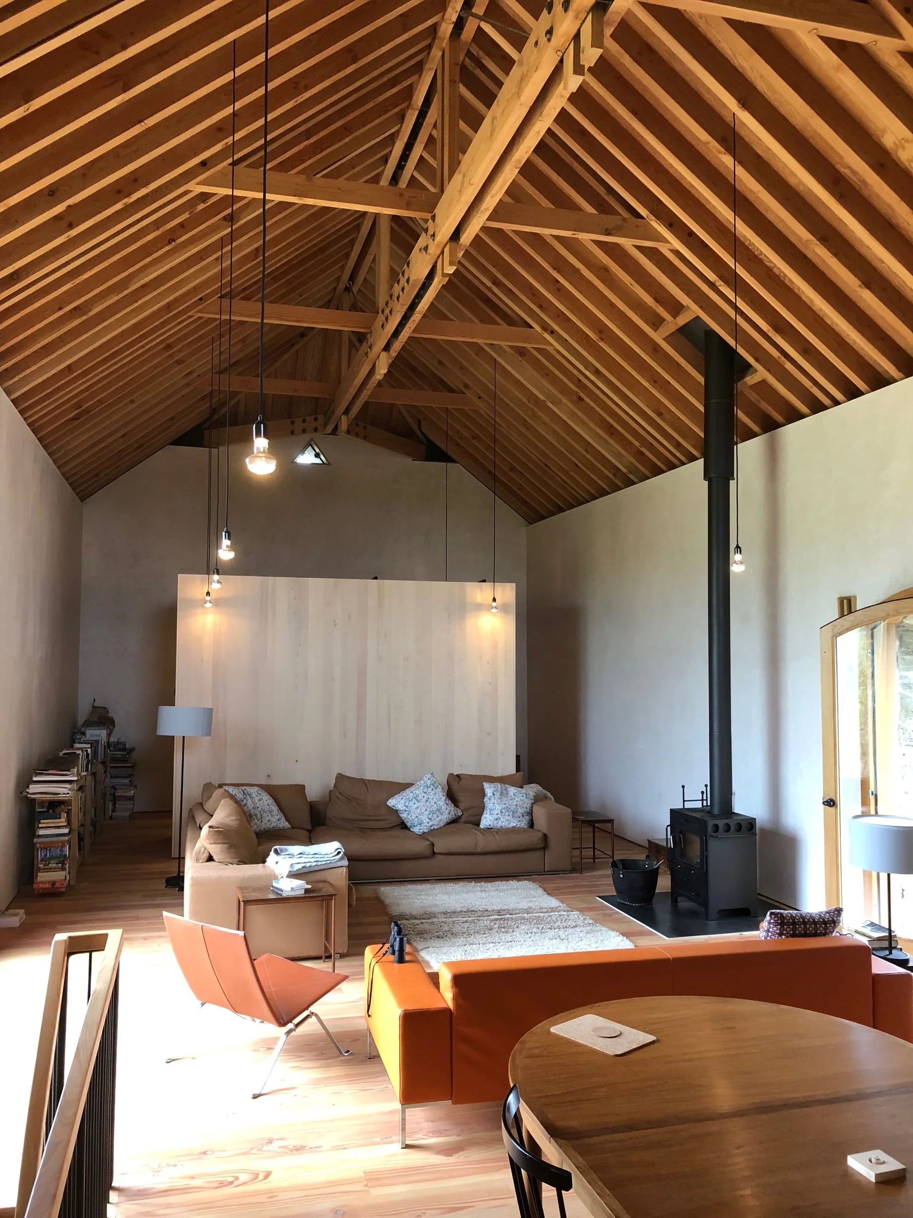 Open plan 1st floor showing black light pendant drops.