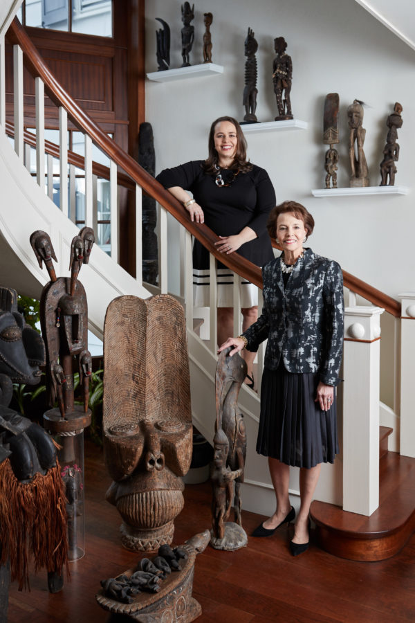 Cricket and Grace pose with African and New Guinea art collected by Grace’s Lockhart grandparents. Photos By ChiChi Ubiña