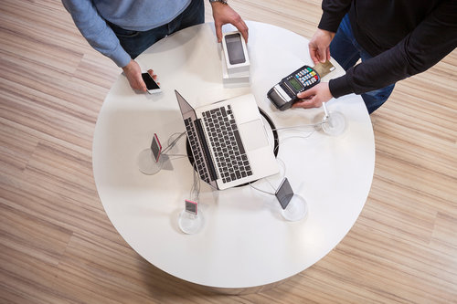 man-buying-smartphone-and-paying-with-credit-card-PU7RFGH.jpg
