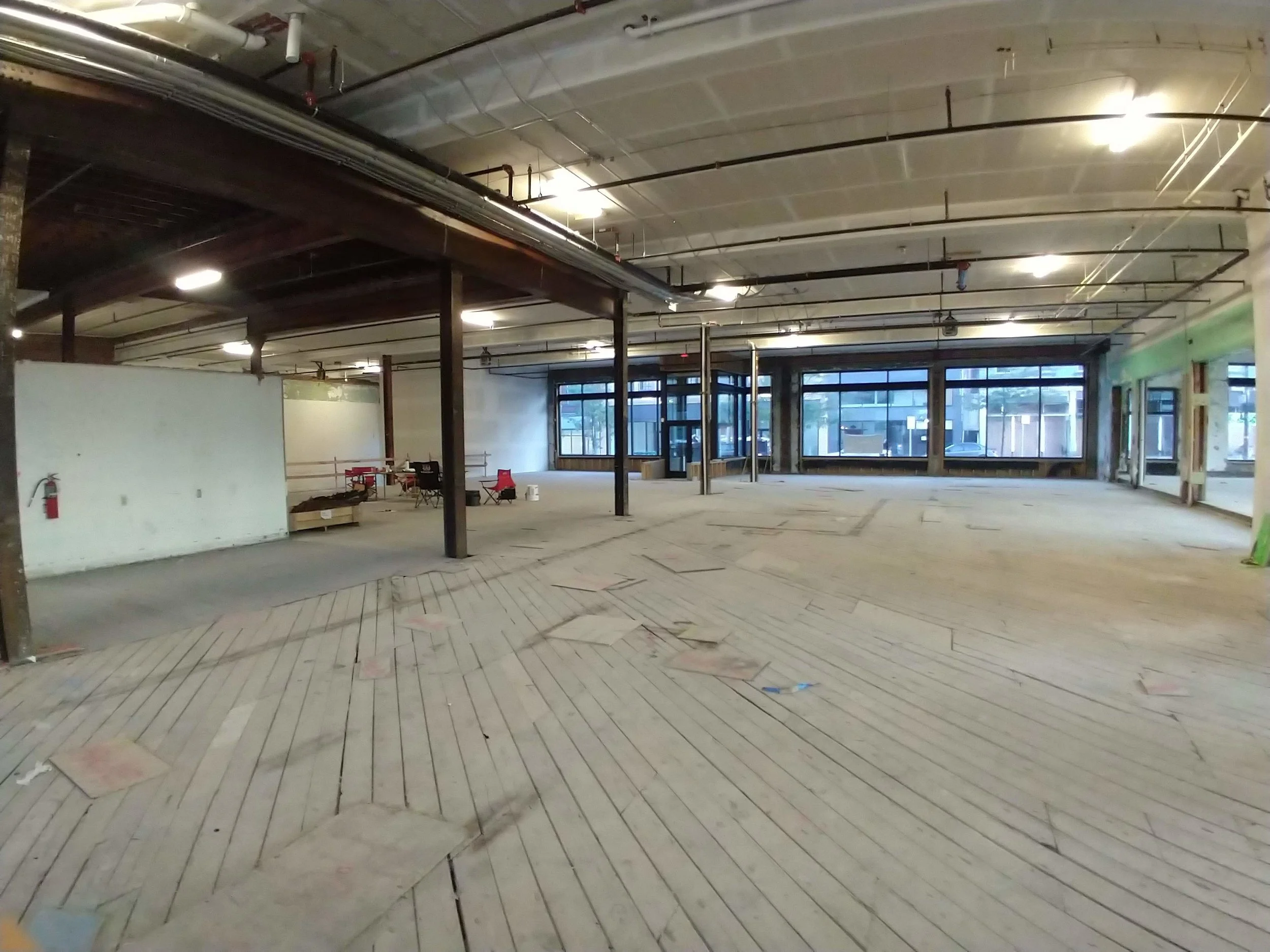A 32’ bar is planned for the center of the space, running along the vertical beams and wrapping around at the end. In keeping with the history of the building, the decor will convey an Art Deco vibe.