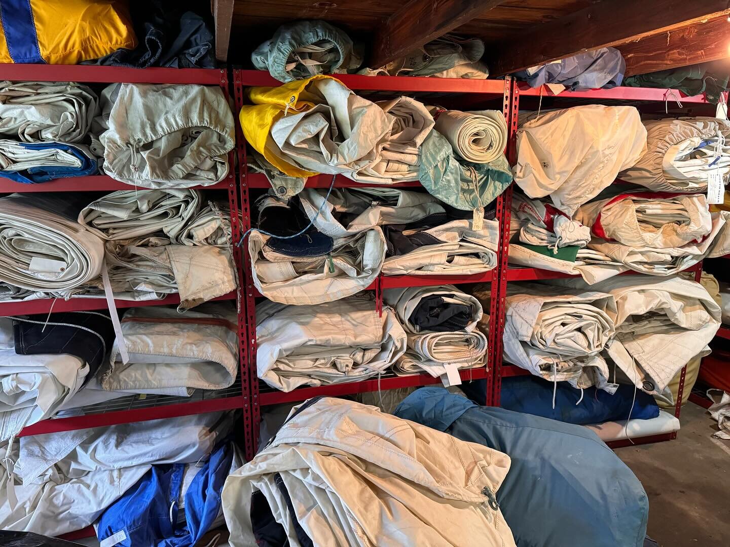 When is enough old sails enough in up-cycling? This is a part of our inventory of old sails that we use in the manufacturing of our products! Here at Metamorphic Gear, we want to share a behind the scenes view of upcycle bag manufacturing and show th