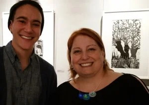 Kris (right) is joined by a young art fan at the opening reception.