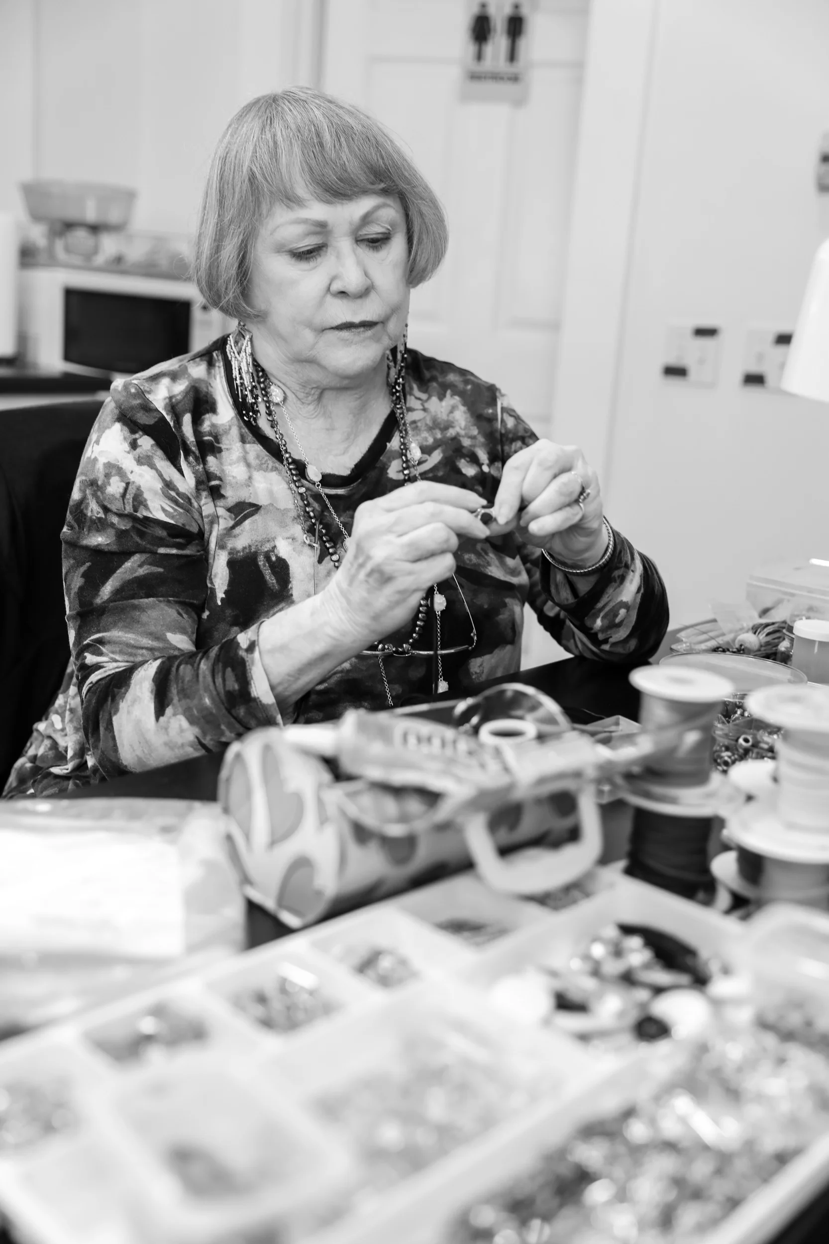 Patsy Roberts working on a strap for a purse. Photo credit Kelly Strawinski.jpeg