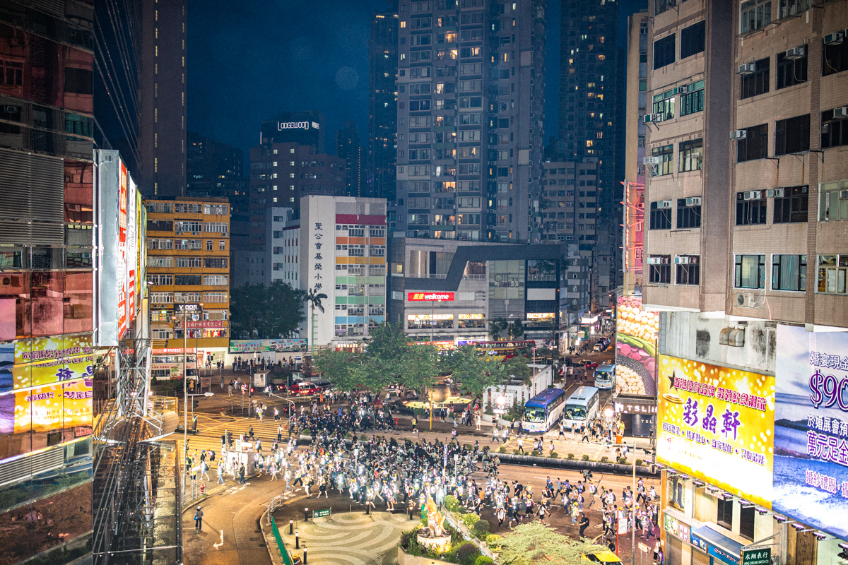 19.08.17 - Riot police and journalists in reflective vests clear Nathan Rd. of protestors.