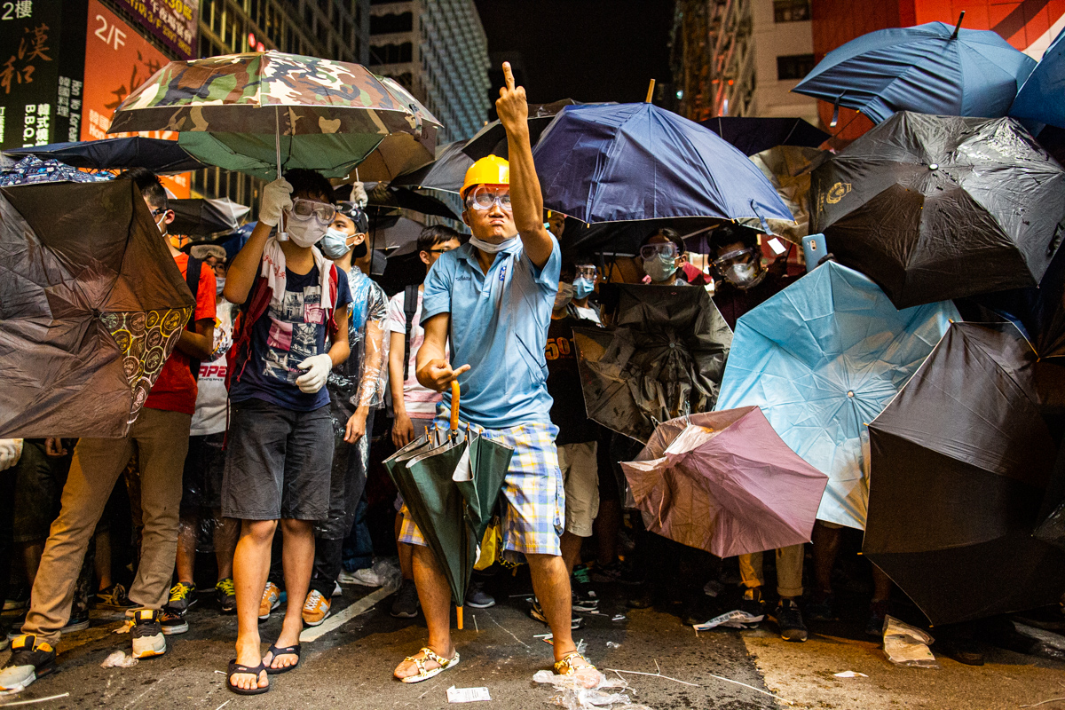 14.10.17 - Hong Kong: Protestors face off with police in Mong Kok. Eric the artist was a well-known protestor.