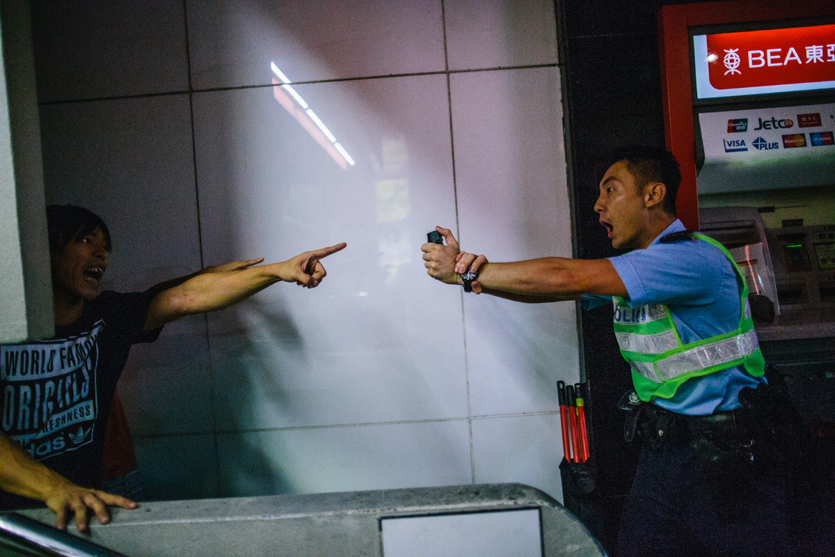 14.10.04 - Hong Kong: Protestors and police square off.
