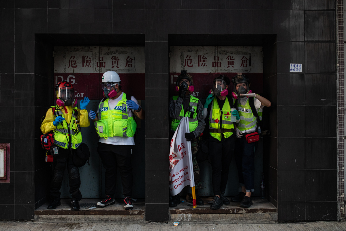 19.08.24 - Medics take cover in a door way.