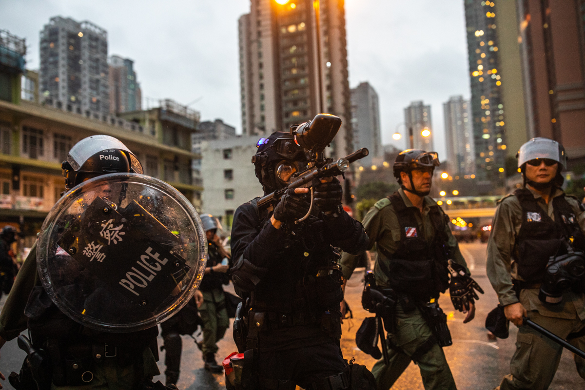 19.08.25 - Police on recon and aiming a gun used to fire pepper balls.