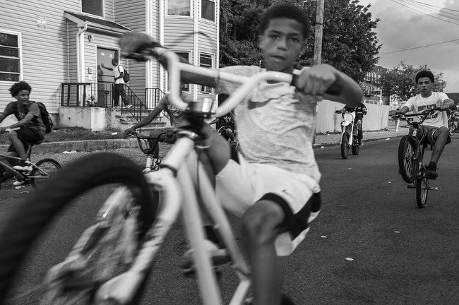 Online Exhibition - American Idyll @TruthInPhotography⁠⁠
⁠⁠
Photo caption:⁠⁠⁠
1) A bike crew riding near the corner of Summer Street and Broadway. 2016-2017. ⁠⁠
2)The grandmaster of the Peruvian pride parade leads followers at the annual event. Pater