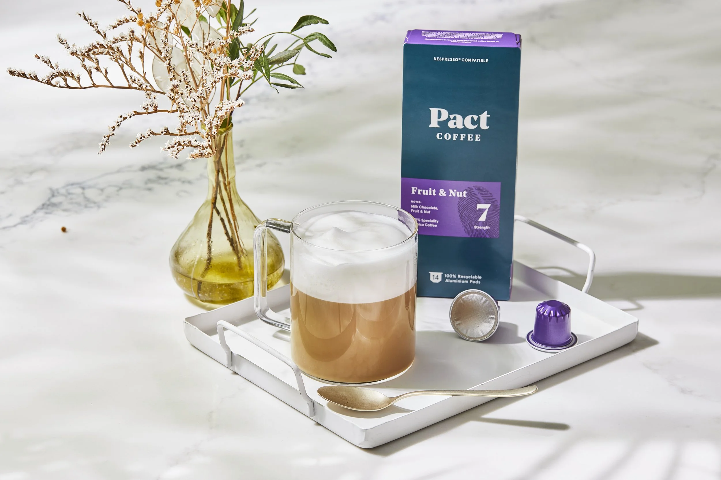 Iced_coffee_with_packaging_hand_pouring_milk_250.jpg