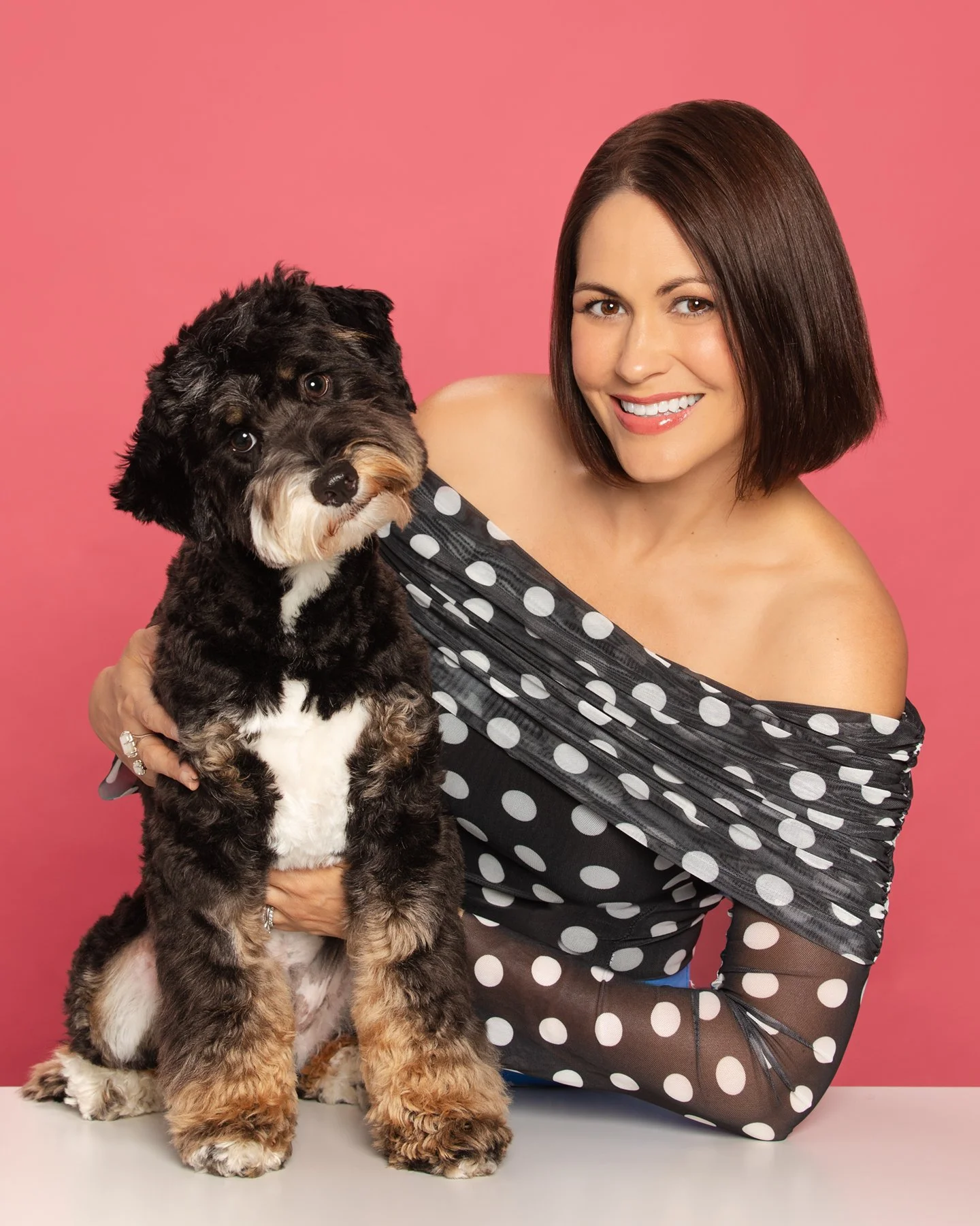 Professional headshot of Abra Zawacki, and her Dog.