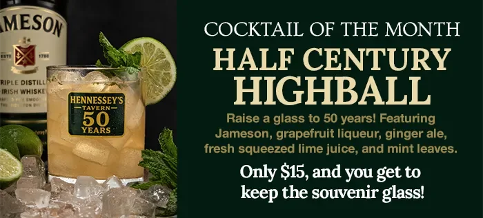 Half Century Highball garnished with a lime slice and mint, labeled "Hennessey's Tavern 50 Years," with limes, mint, and a whiskey bottle in the background.