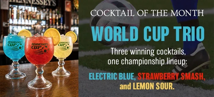 Hennessey’s Cocktail of the Month features the World Cup Trio—Electric Blue, Strawberry Smash, and Lemon Sour—served over ice in branded glasses with fresh lemon garnishes.