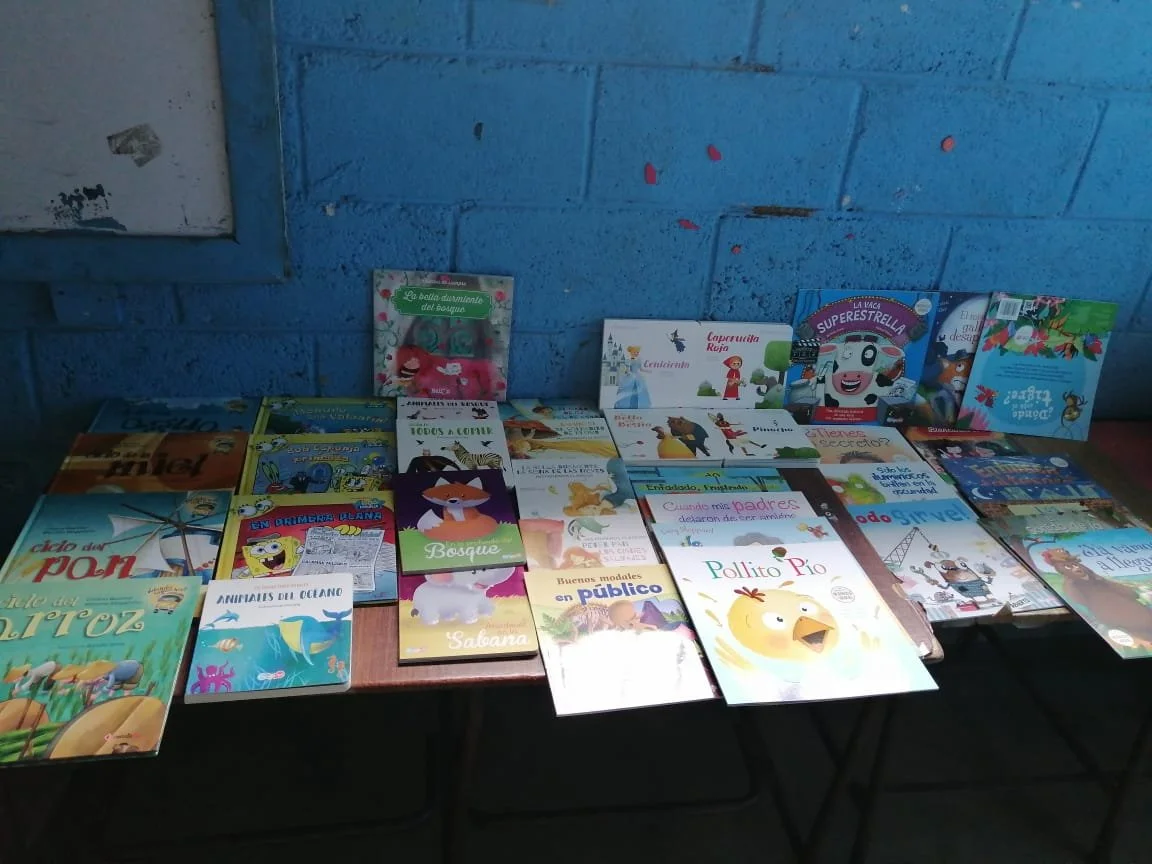 Maria Lopez shows all books.JPG