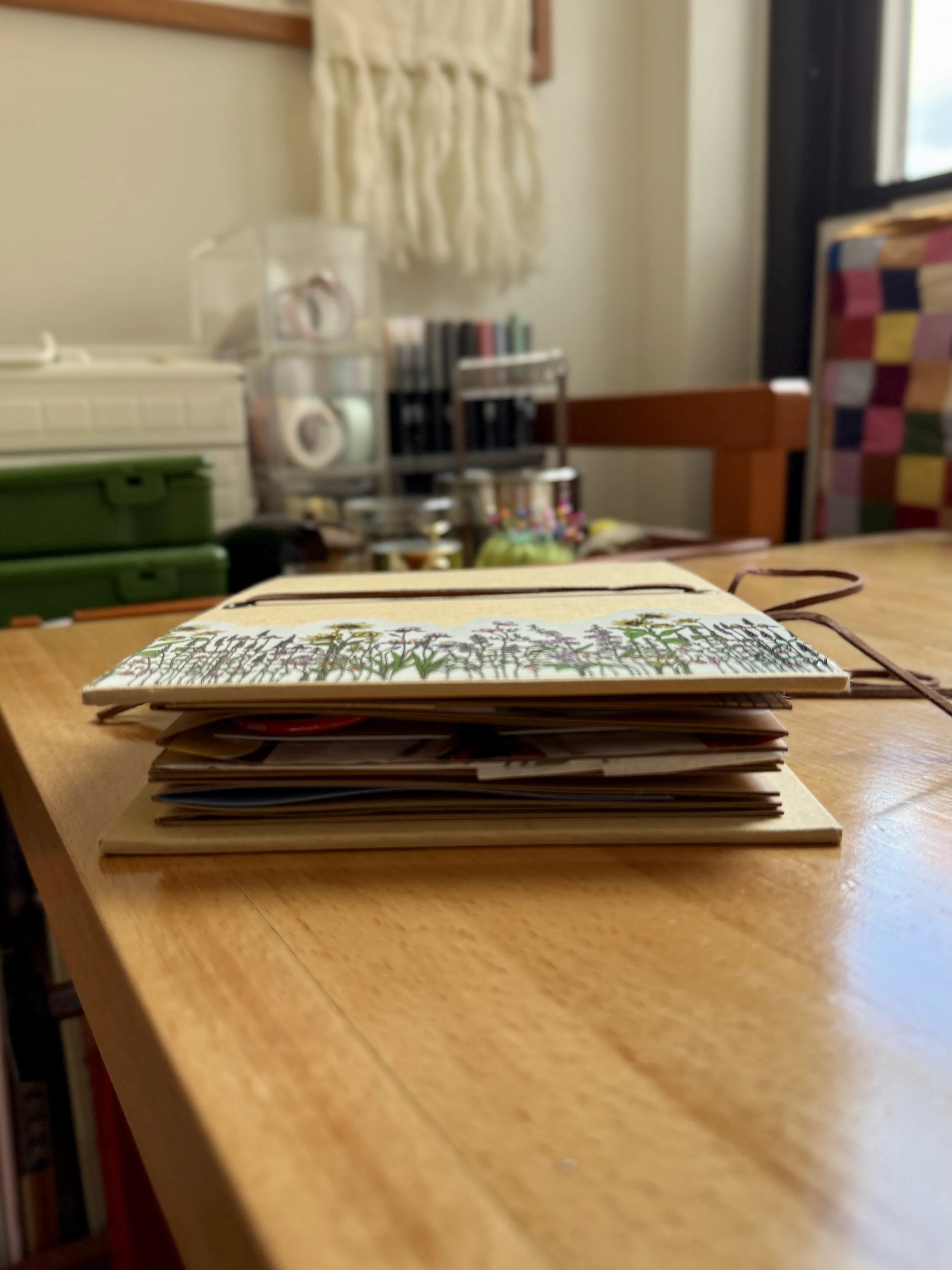 junk journal photographed from the side, showing how thick it is