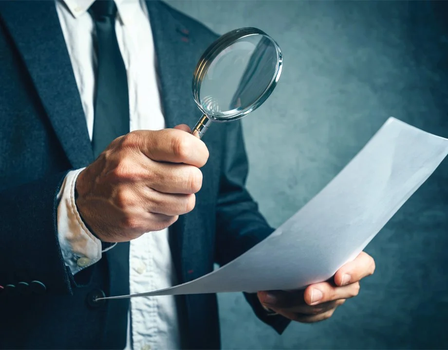Private investigation company reviewing case documents for clients in NYC, Bergen County, NJ and Stamford, CT