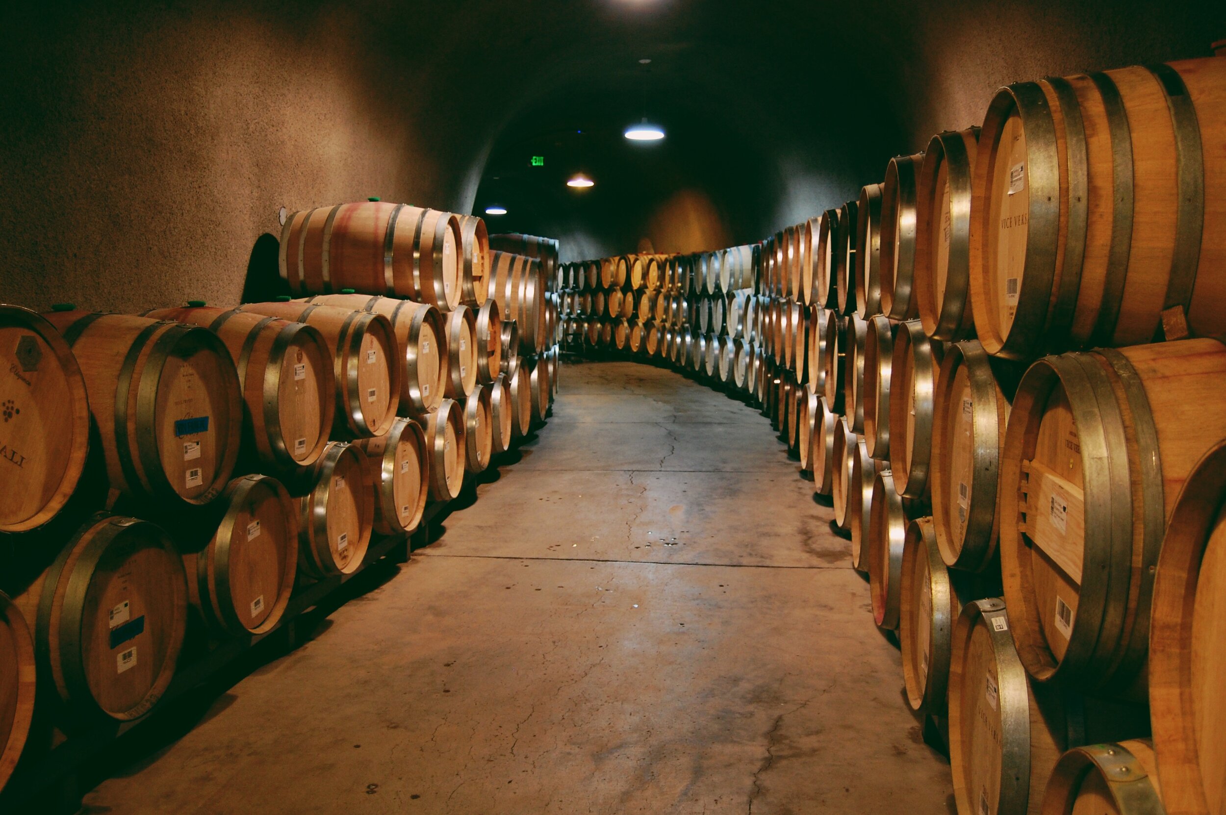 Barrels stacked and lined up in the cellar