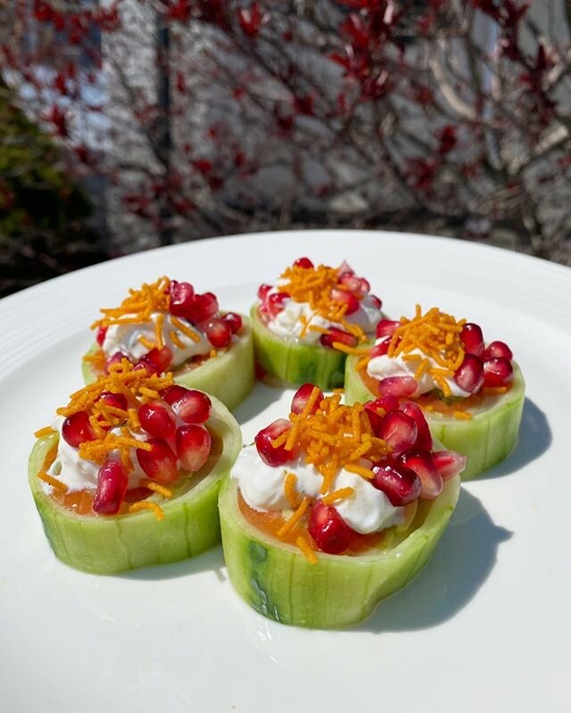 Kachori Roll - Yellowtail, Salmon &amp; Avocado wrapped in cucumber. Topped with green apple raita (yogurt dressing), pomegranates &amp; curry spiced potato strings