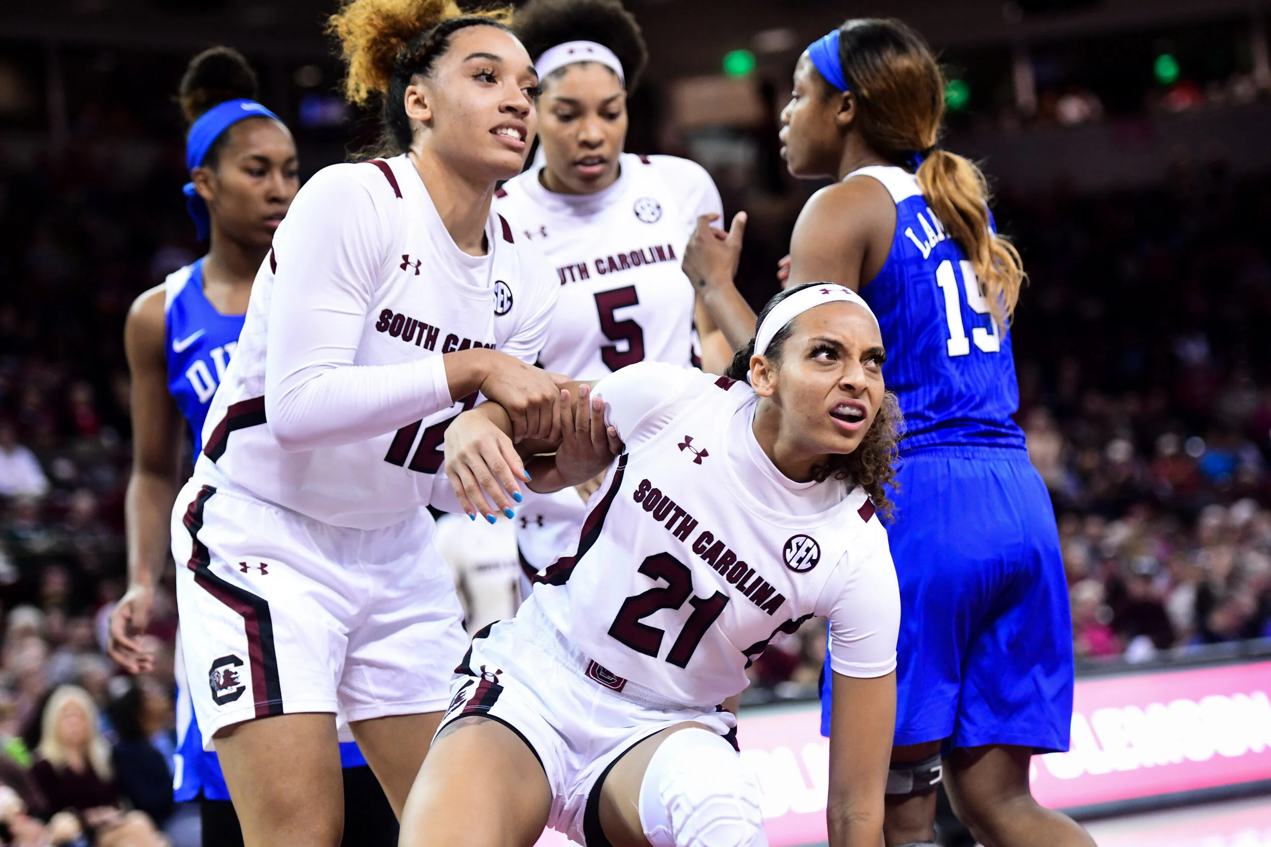 South Carollina players help another off the floor