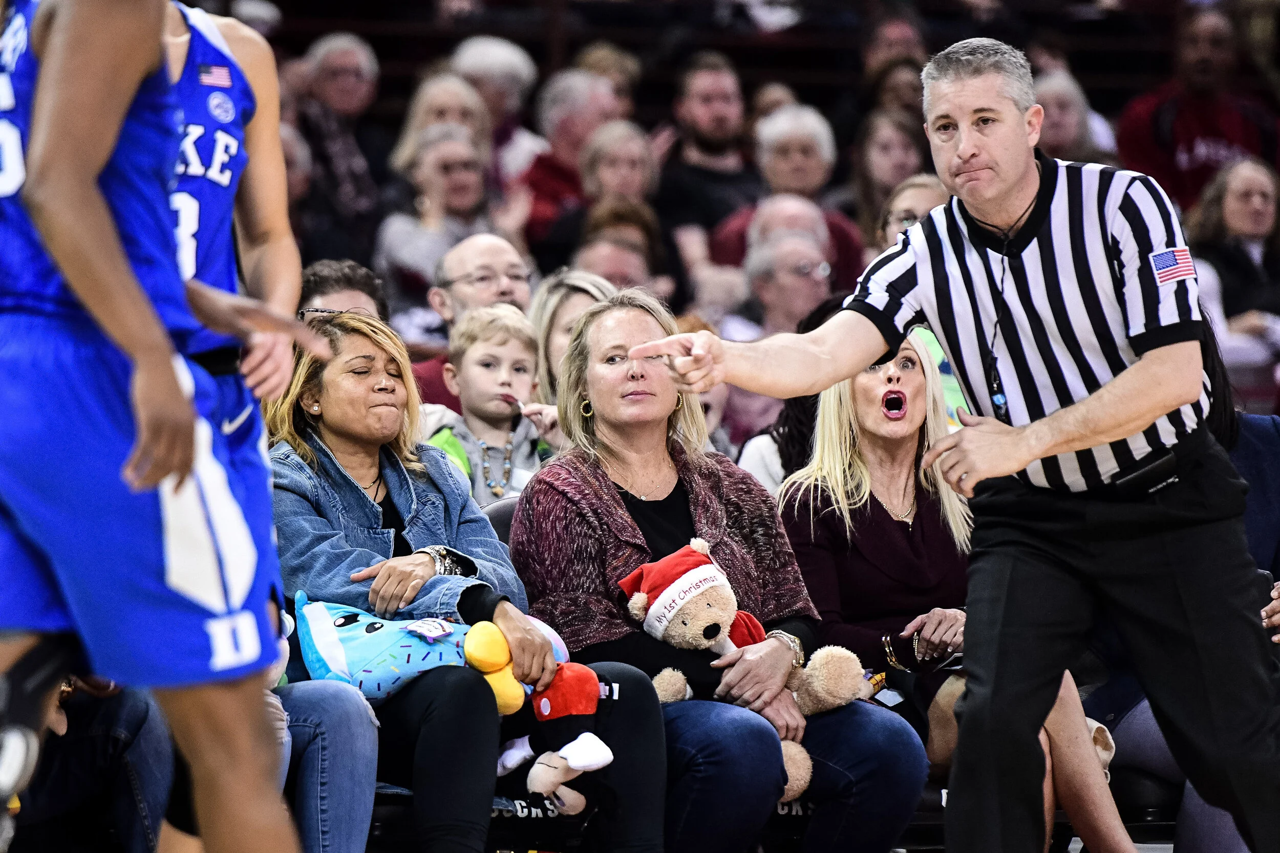 Basketball fans reaxct to an official's call