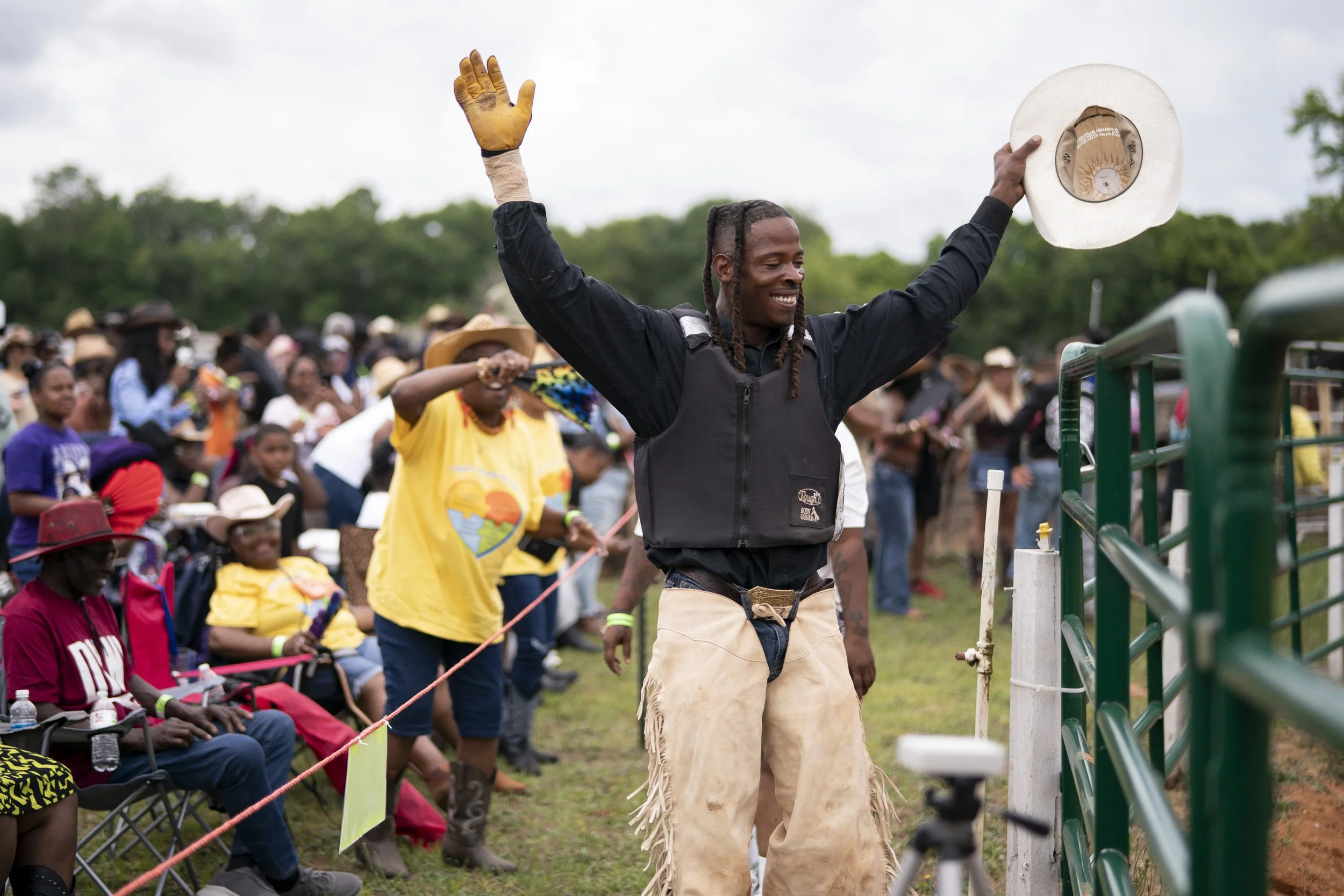 Cowboy celebrates after bronc ride