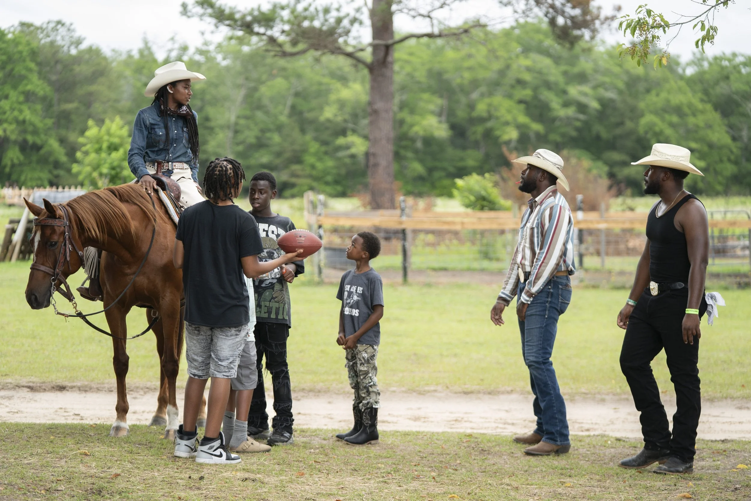 Young cowboys and a cowgirl