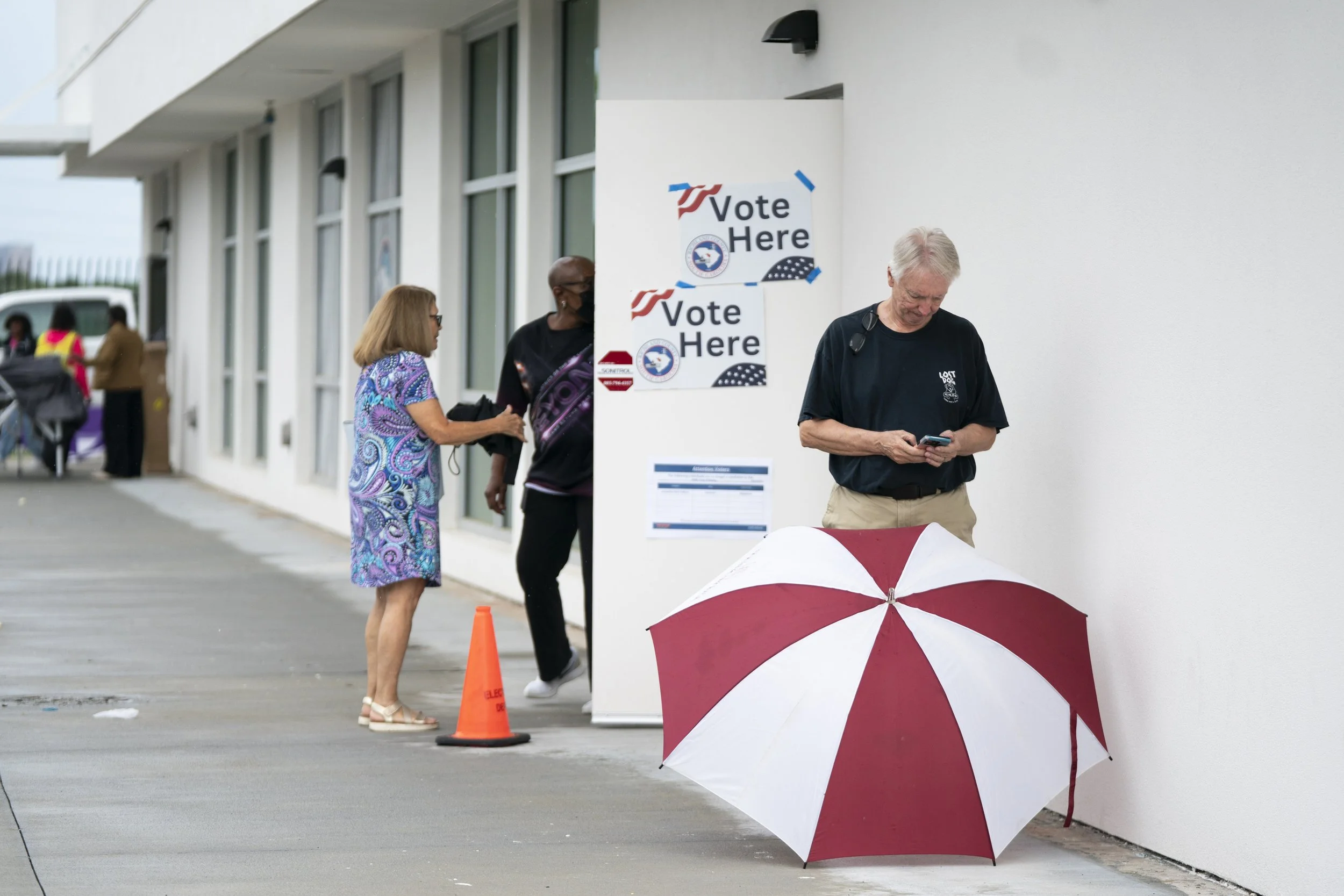People outside a voting location in Columbia