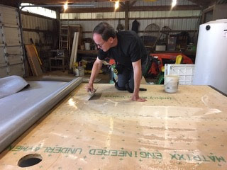 John laying down epoxy adhesive