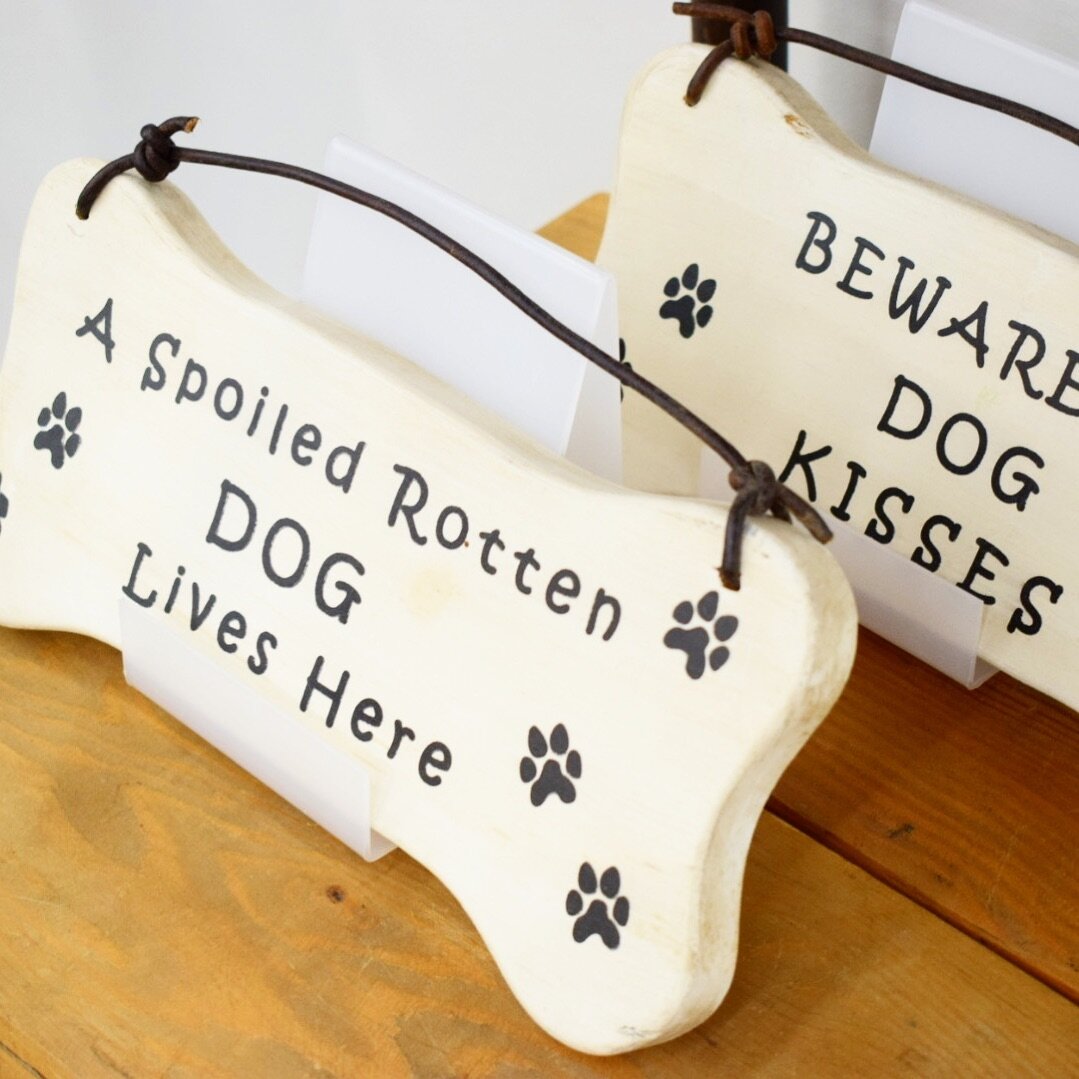🐾 Can you relate?
.
Hang one of our Dog Bone signs to put friends and family on notice that your fur baby rules the domain and they are now entering the slobber zone! 💦
.
Available now at @shops.paintedtree.sparks!
.
Have another fun idea?
Let us k