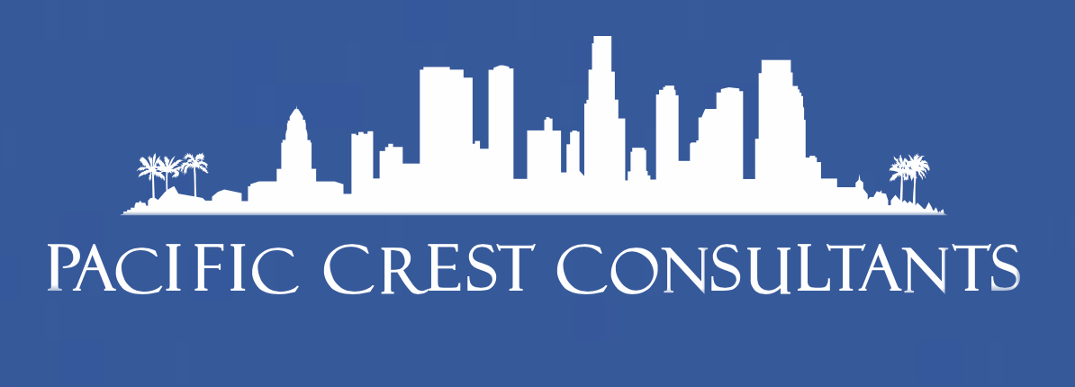 Logo of Pacific Crest Consultants featuring a white city skyline and palm trees on a blue background, with the company name in white capital letters.