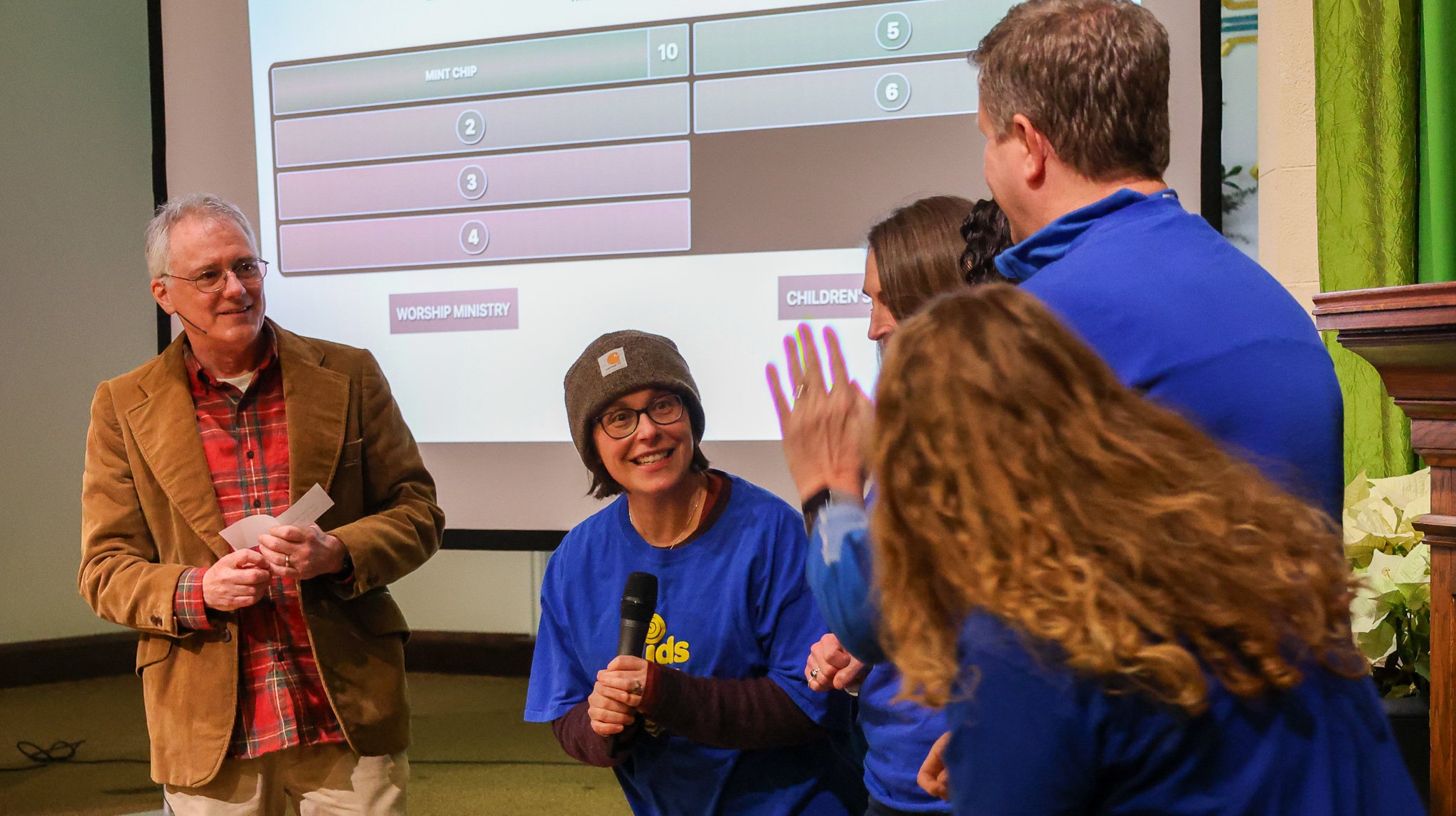 Our Annual Celebration continued with a Church of the Cross edition of FRIENDLY FEUD, featuring members of the Children's Ministry Team vs members of the Worship Team. With high team spirits, they joyfully dueled over questions answered by 53 members
