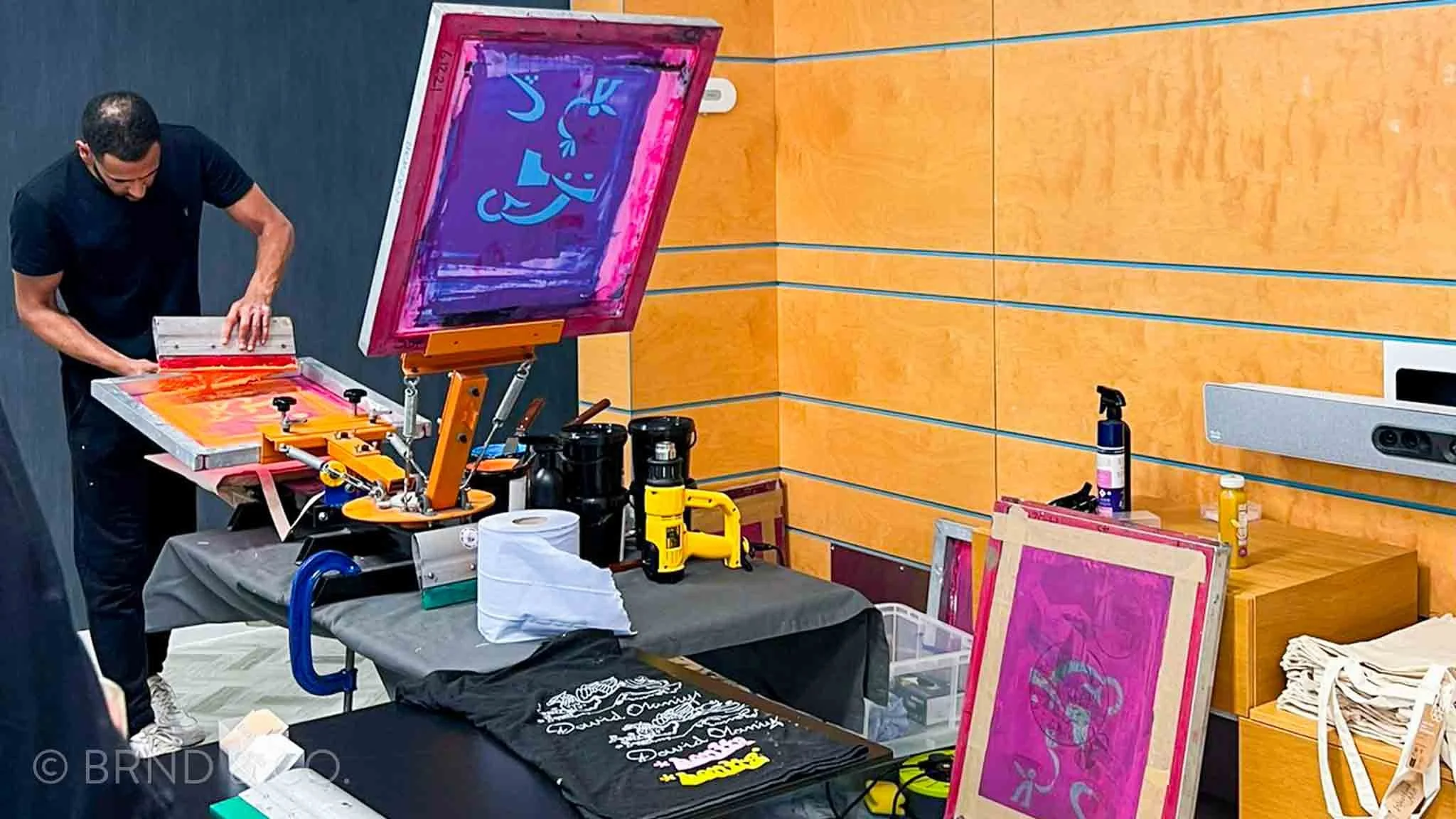 Brandan screen printing a t-shirt at the Amazon x RING Live Screen Printing Event
