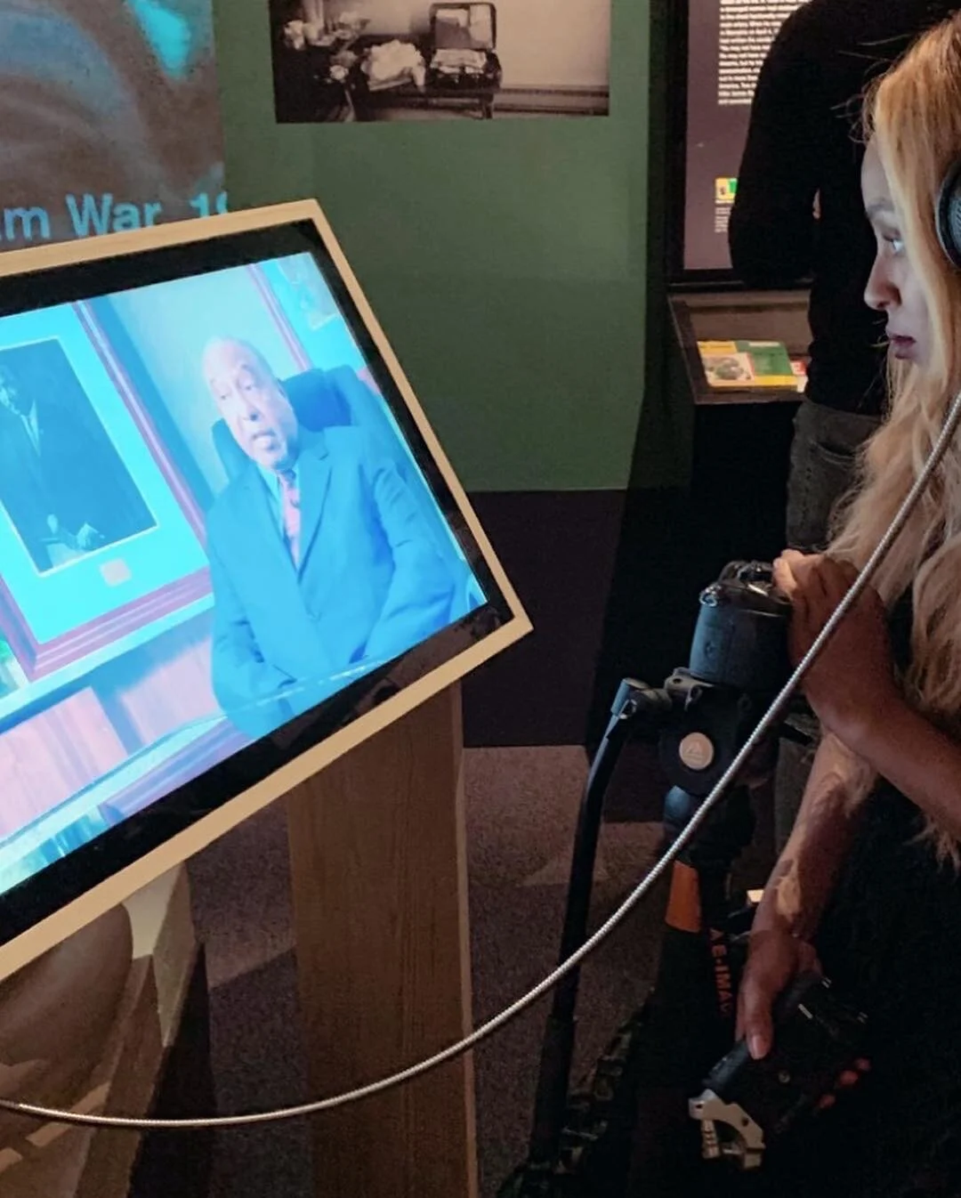  Alahna watching her production at the Nobel Museum Exhibit,  A Right to Freedom . 