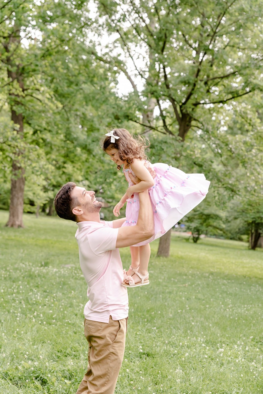 father lifting daughter in park  St. Louis Family Photography sarahrowlandphotography.com