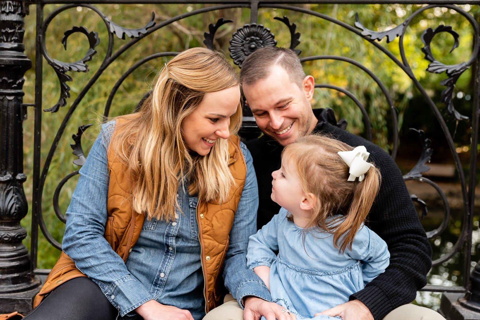 family snuggled on bridge  St. Louis Family Photography sarahrowlandphotography.com