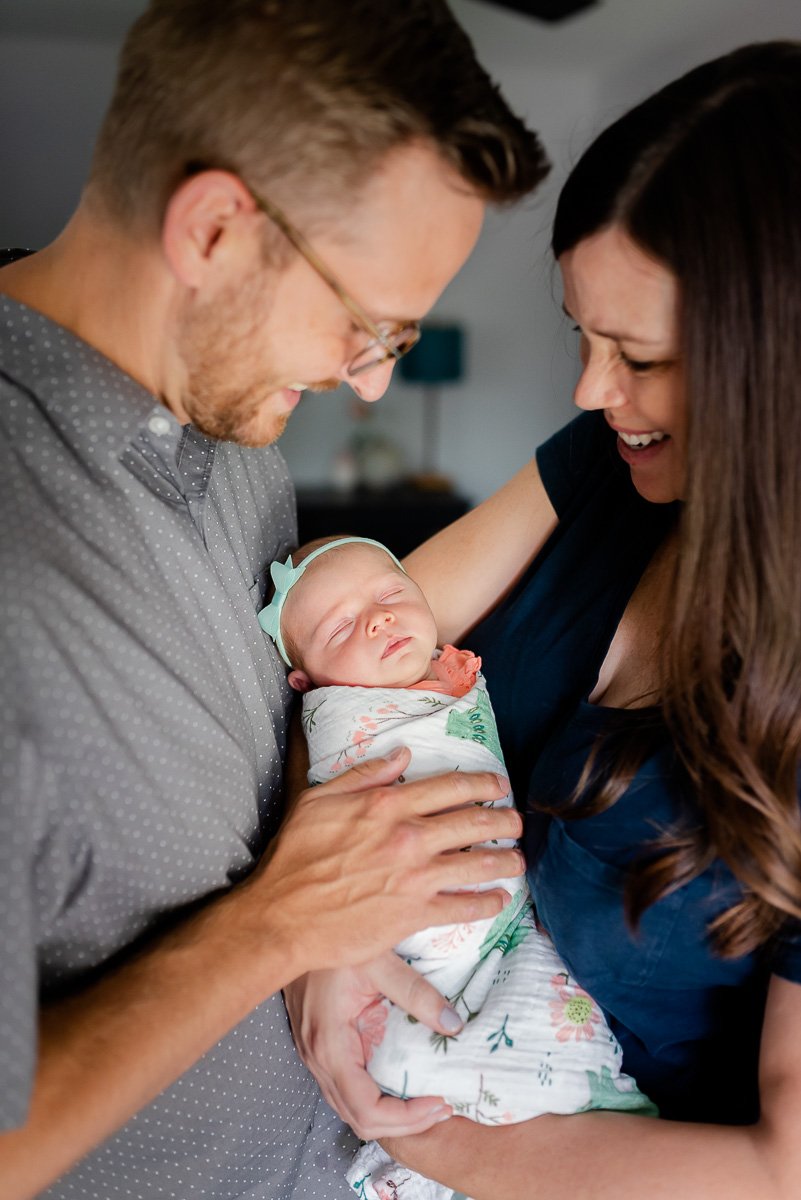 parents holding newborn baby  St. Louis Newborn Photography sarahrowlandphotography.com