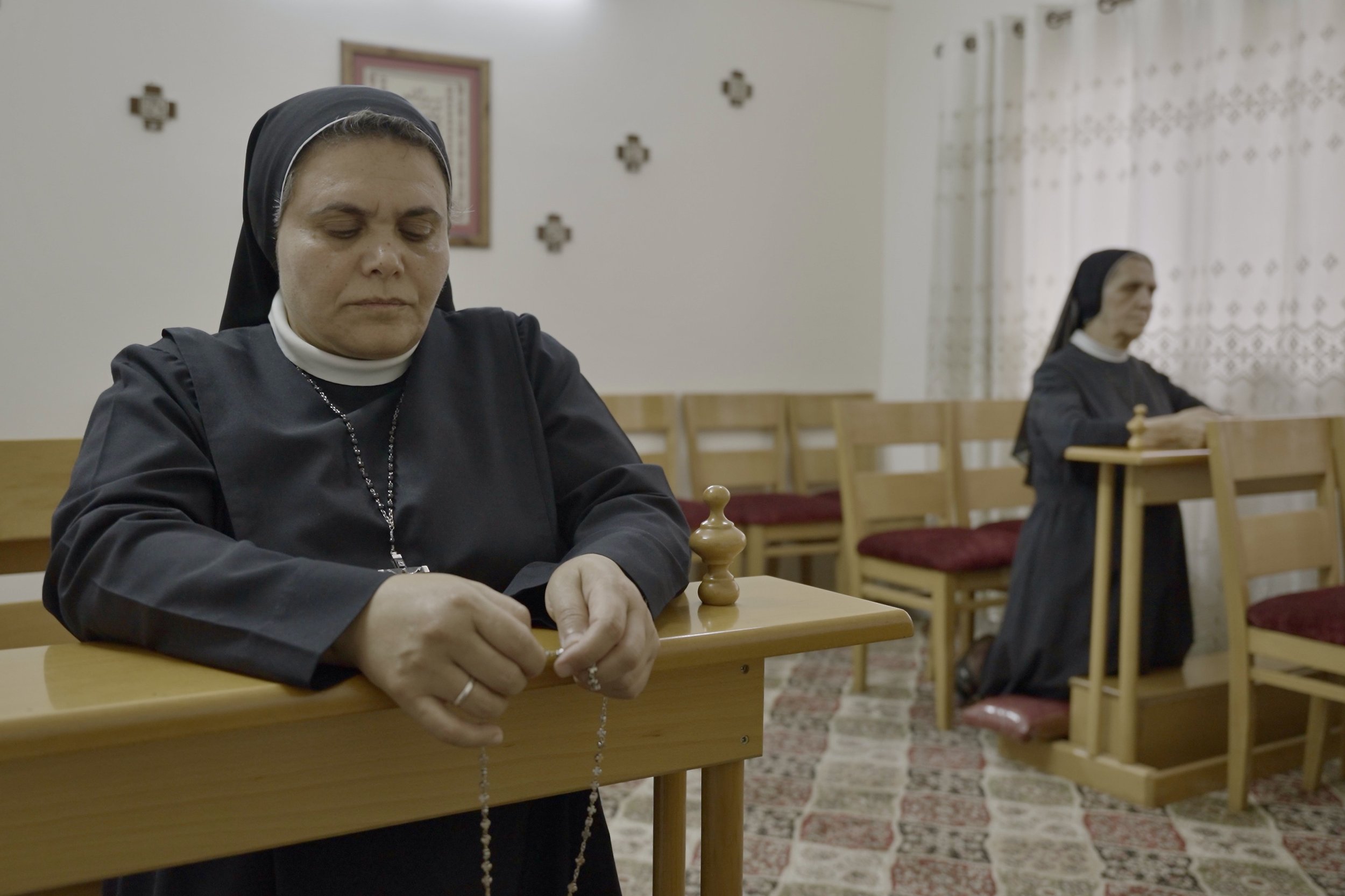    Sister Nabila praying the rosary at the chapel of the Rosary Sisters School of Gaza   