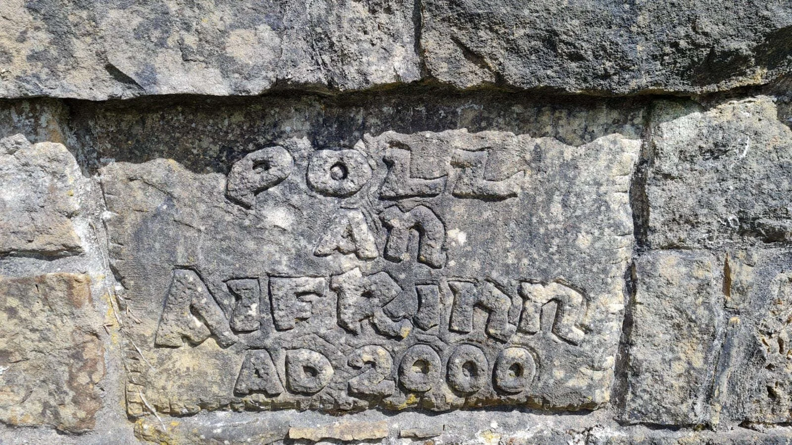 Inscription carved into a Mass Rock commemorating worship in 2000